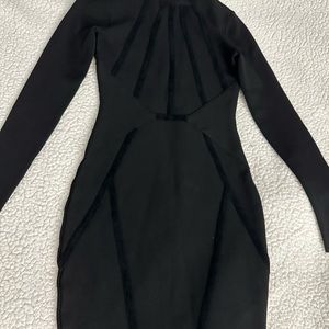 Black mini dress By Marciano. Great for a night out. Thick material